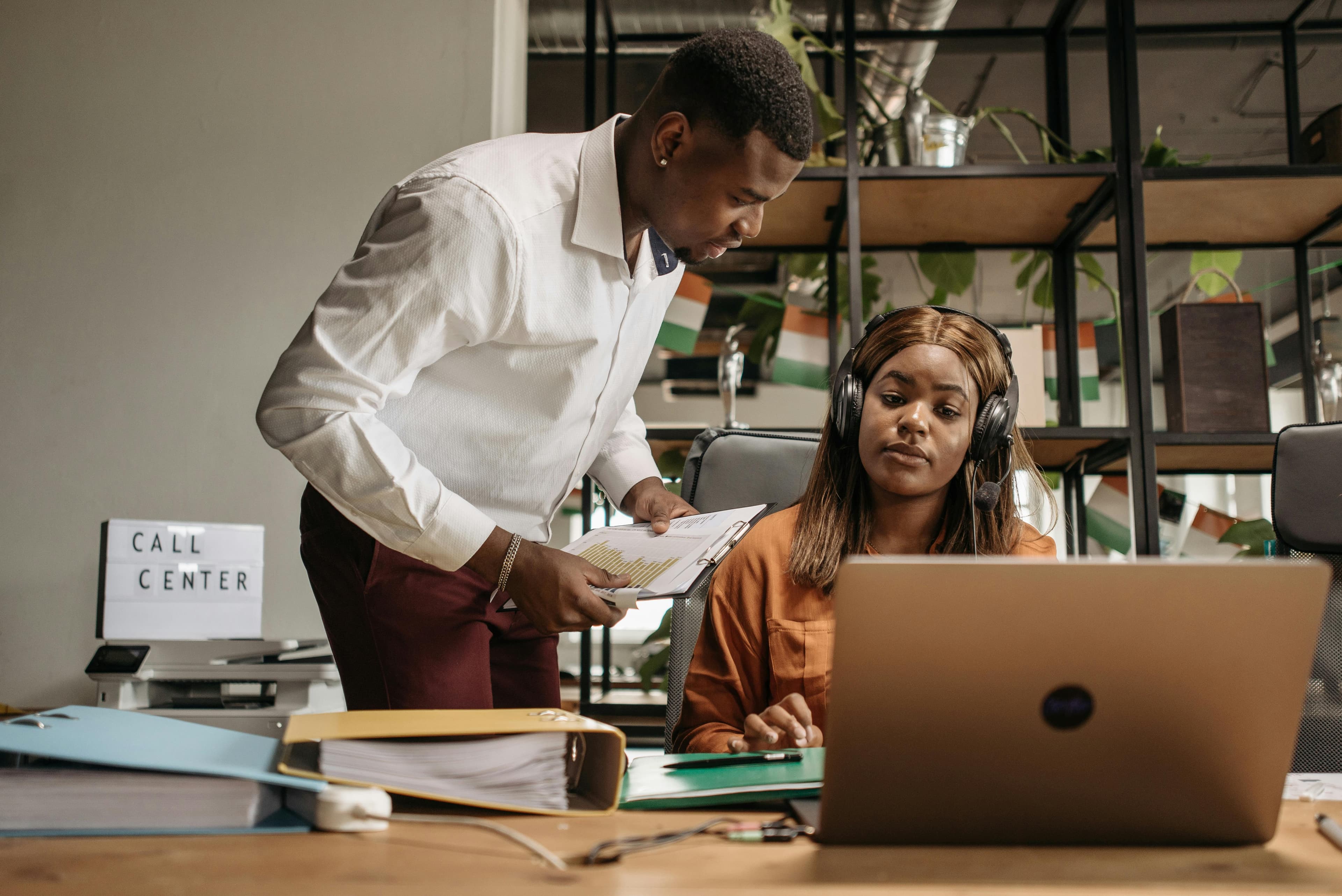 AstaBill support team helping a customer review documents and find answers